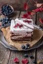 Sliced cake with wild berries and chocolate. Royalty Free Stock Photo