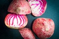 Sliced Candy Cane Beets, also known as Chioggia Beets, arranged on a baking tray.