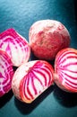 Sliced Candy Cane Beets, also known as Chioggia Beets, arranged on a baking tray.