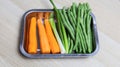 sliced carrots, chives and green beans on a bowl Royalty Free Stock Photo