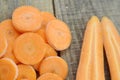 Sliced carrots and double cut on wooden rustic Royalty Free Stock Photo