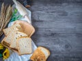 Sliced cereal bread on wood worktop, copy space for healthy issue