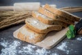 Sliced cereal bread on wood worktop and wood tray, for healthy i