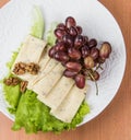 Sliced cheese salad and grapes walnut Royalty Free Stock Photo