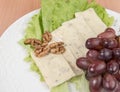 Sliced cheese salad and grapes walnut Royalty Free Stock Photo