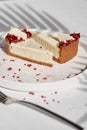 Sliced Cheesecake. Layer of biscuits, mousse based on creamcheese, with raspberry. Healthy dessert. Royalty Free Stock Photo