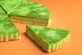 Sliced cheesecake made with matcha green powder