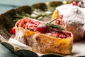 Sliced cherry strudel with cranberries and walnut. Food recipe background Royalty Free Stock Photo