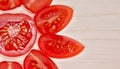 Sliced cherry tomatoes macro wooden background Royalty Free Stock Photo