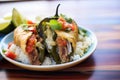 sliced chiles rellenos showing cheese and meat filling