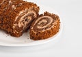 Sliced chocolate roll on white dish