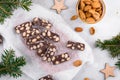 Sliced chocolate salami with almond on a baker paper, Christmas dessert Royalty Free Stock Photo