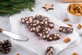 Sliced chocolate salami with almond on a baker paper, Christmas dessert Royalty Free Stock Photo