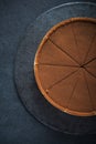 Sliced chocolate tort on dark background