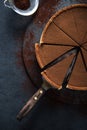 Sliced chocolate tort on dark background