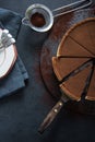 Sliced chocolate tort on dark background