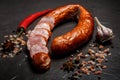 Sliced circle of dry cured ham sausage with garlic and chili Royalty Free Stock Photo