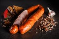 Sliced circle of smoked sausage with garlic, chili and rye bread Royalty Free Stock Photo