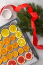 Sliced citrus on baking sheet Royalty Free Stock Photo