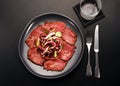 Sliced cold roast beef with fresh radicchio salad Royalty Free Stock Photo