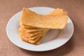 Sliced crispy bread in white ceramic dish. Royalty Free Stock Photo