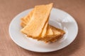 Sliced crispy bread in white ceramic dish. Royalty Free Stock Photo