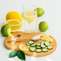 Sliced cucumber and orange , a spoon with salt and a glass with water and lemon Royalty Free Stock Photo