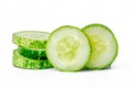 Sliced cucumbers for fresh vegetables, in a stacked composition, isolated on a white background Royalty Free Stock Photo