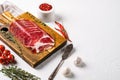 Sliced cured coppa ham, on white stone table background, with copy space for text Royalty Free Stock Photo