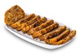 Sliced delicious fruitcake in white ceramic tray