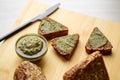 Sliced diet grain bread spread with pesto sauce Royalty Free Stock Photo