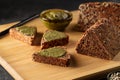 Sliced diet grain bread spread with pesto sauce Royalty Free Stock Photo