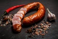 Sliced dry-cured smoked ham sausage with garlic and chili Royalty Free Stock Photo