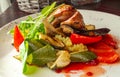 Sliced duck fillet in red berry sauce, salad, bell pepper, zucchini, mashed potatoes Royalty Free Stock Photo