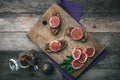 Sliced figs and bread with jam on choppingboard in rustic style Royalty Free Stock Photo