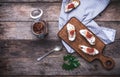 Sliced figs, jam and Bruschetta on choppingboard in rustic style Royalty Free Stock Photo