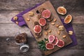 Sliced figs, nuts and bread with jam on choppingboard in rustic Royalty Free Stock Photo