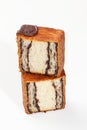 Sliced fluffy cube shaped croissant with marzipan chocolate filling and chocolate seal