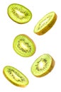 Sliced flying kiwi isolated on white background with clipping path. cut kiwi fruit in pieces isolated on white background. Levity Royalty Free Stock Photo