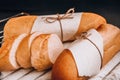 Sliced french baguette with crumbs on dark background Royalty Free Stock Photo