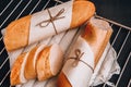 Sliced french baguette with crumbs on dark background Royalty Free Stock Photo