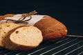 Sliced french baguette with crumbs on dark background Royalty Free Stock Photo