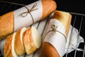 Sliced french baguette with crumbs on dark background Royalty Free Stock Photo