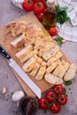 Sliced French bread baguette on wooden bread board Royalty Free Stock Photo