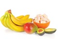 Sliced fresh avocado, mango, bananas and candies Royalty Free Stock Photo