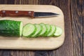 Sliced fresh cucumber and knife Royalty Free Stock Photo