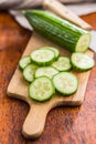 Sliced fresh green cucumber on cutting board Royalty Free Stock Photo