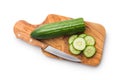 Sliced fresh green cucumber on cutting board isolated on white background Royalty Free Stock Photo