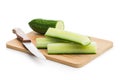 Sliced fresh green cucumber on cutting board isolated on white background Royalty Free Stock Photo