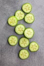 Sliced fresh green cucumber on kitchen table. Top view Royalty Free Stock Photo